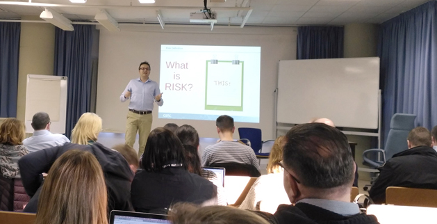 Man presenting slides to meeting audience