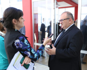 Woman interviewing man at a conference