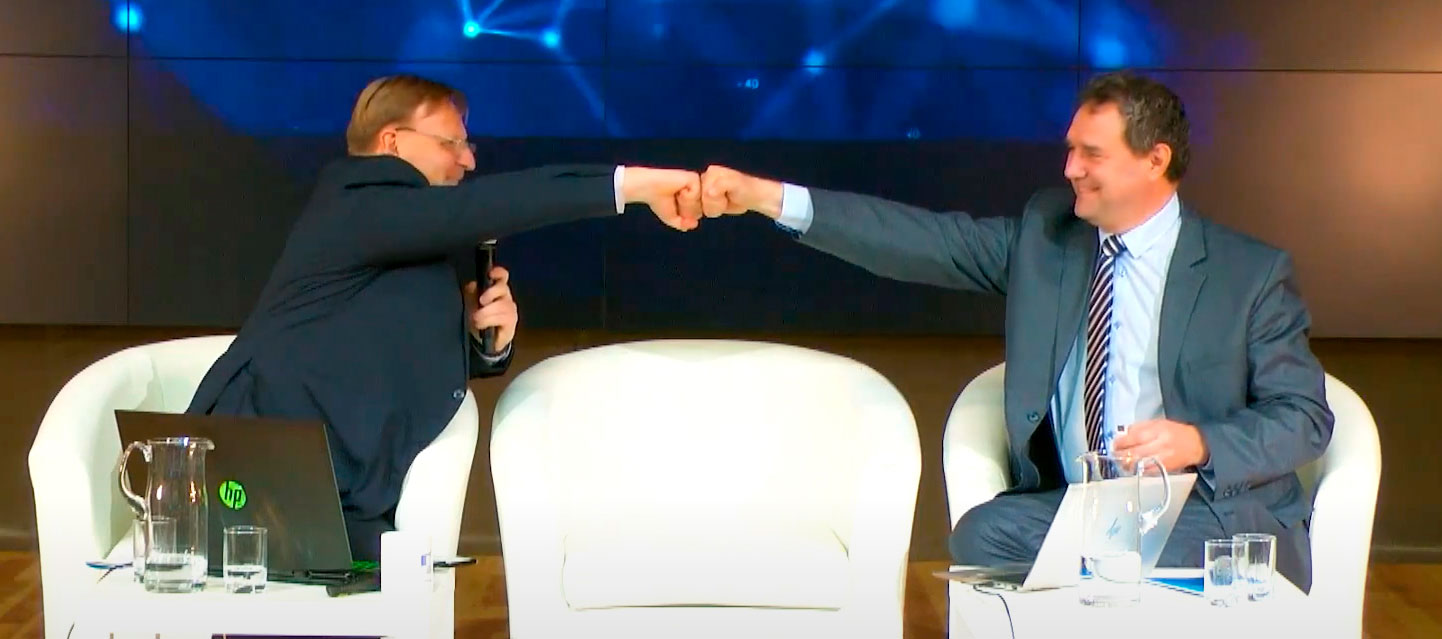 Two men fist-bumping