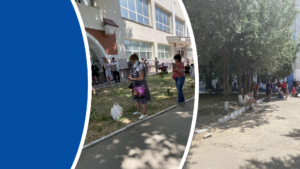 Kherson residents gather outside the KNTU buildings for internet connectivity